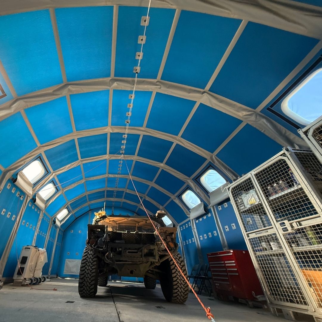 inflatable tent with gear inside including vehicle