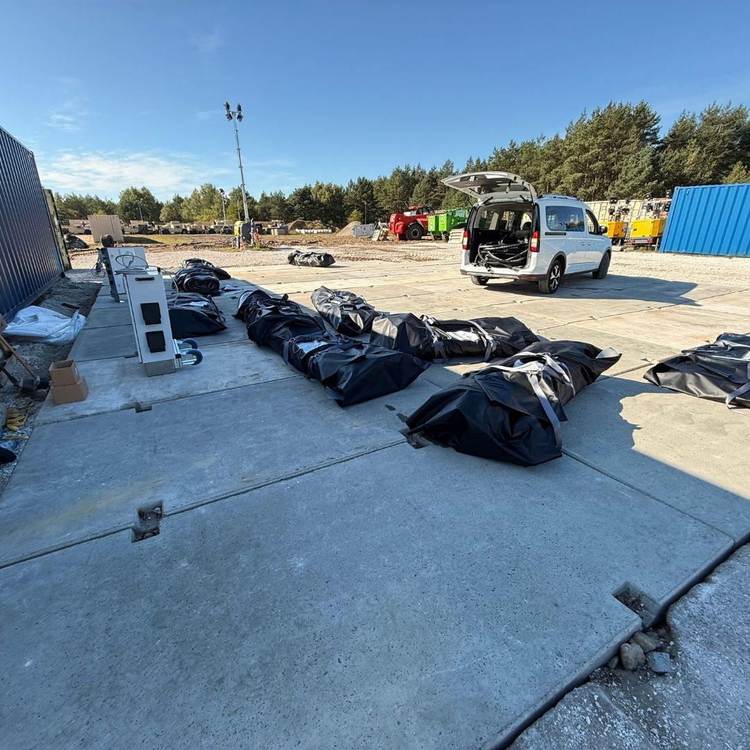 inflatable tents rolled up on ground
